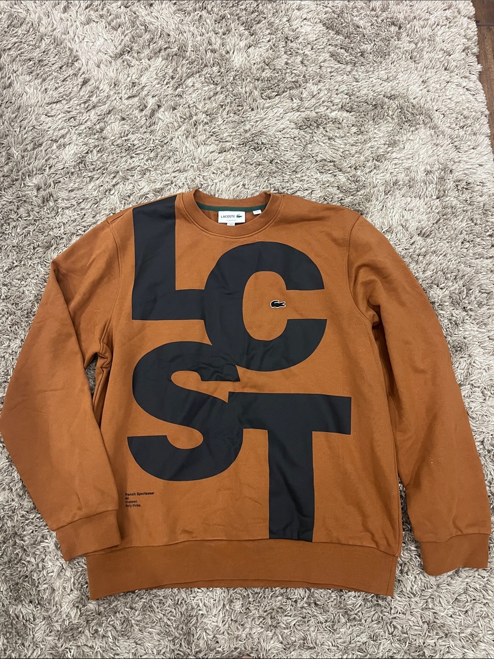 Lacoste Men’s Rust Brown Crewneck Sweatshirt with Large Black LCST Print